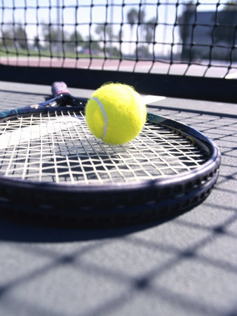 Tennis Ball on a Tennis Racket Photographic Print