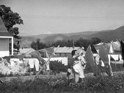 Housewife in Tygart Valley Removing Laundry from Clothesline, Her Young Daughter Stands Beside Her Photographic Print