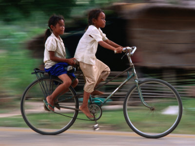 Girls Riding Bicycle in Bavel