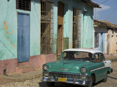 Typical Paved Street with Colourful Houses and Old American Car Trinidad