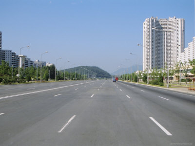waltham-anthony-blocks-of-flats-beside-road-to-nampo-ten-lanes-wide-but-no-traffic-pyongyang-north-korea-asia.jpg