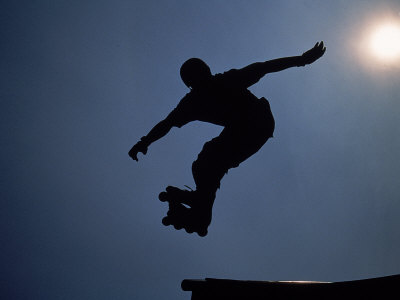 Rollerblader in Mid-Air Photographic Print by Jeff Greenberg