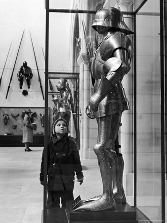 Little Boy Staring Up at Medieval Suit of Armor in the Metropolitan Museum 