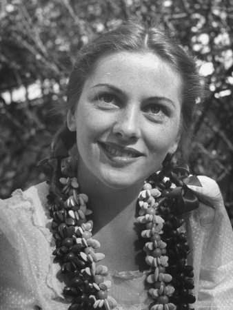 landry-bob-actress-joan-fontaine-sporting-pigtails-and-her-natural-freckles-in-yard-at-home.jpg