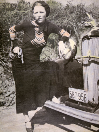 bonnie-parker-posing-tough-with-a-gun-and-cigar-c-1934.jpg