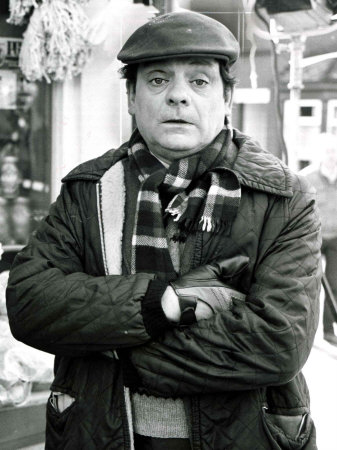 david-jason-posing-as-character-granville-from-bbc-tv-program-open-all-hours-outside-grocery-shop.jpg