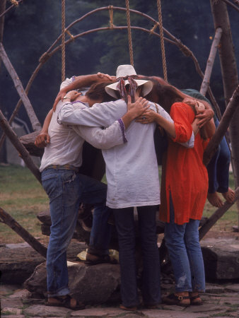 dominis-john-young-people-huddled-together-in-front-of-swing-at-a-playground-woodstock-music-and-art-fair.jpg