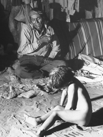 Native American Indian Man in Home with Naked Child Sitting and Drawing in