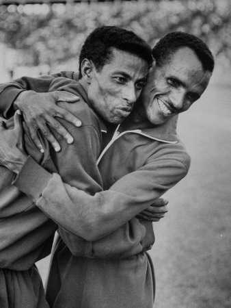 http://cache2.allpostersimages.com/p/LRG/38/3805/W3MIF00Z/posters/ethiopian-runners-abebe-bikila-and-mamo-wolde-during-exhibition-race-at-berlin-olympic-stadium.jpg