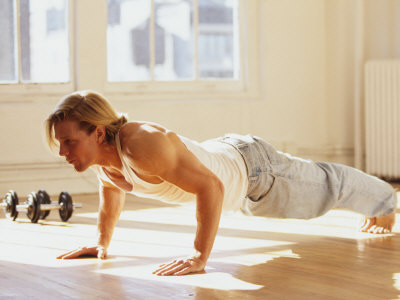 Young Man Preforming Push Up Exercise in Gym, New York, New York, USA Photographic Print by Chris Trotman