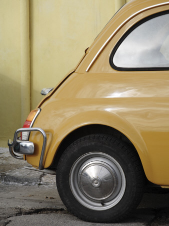 Yellow Fiat 500 Parked Against