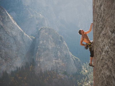 A Climber, Without a Rope, Grips an Expanse of El Capitan Photographic Print by Jimmy Chin