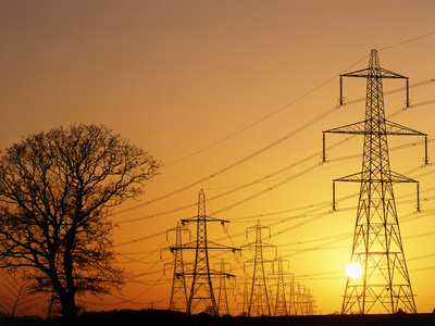 Pylons And Power Lines At Sunset Photographic Print by David Parker