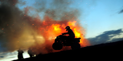 A Man Ride His Atv Next to a Bonfire During the Celebration of Shrovetide Photographic Print by Vassil Donev