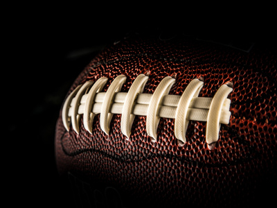 Flying Rugby Ball Isolated on Black. Photographic Print by  Kesu01