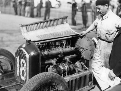 Attilio Marinoni, Chief Mechanic of Scuderia Ferrari, with an Alfa Romeo, 1934 Photographic Print