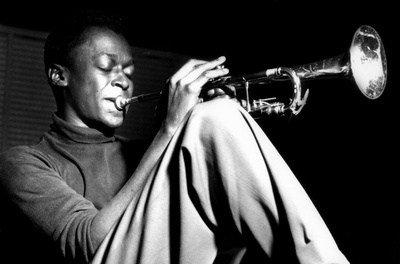 Miles Davis- Sitting With Trumpet Posters