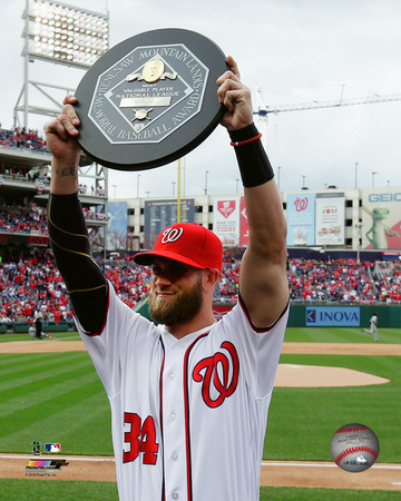 Bryce Harper holds up the 2015 MVP trophy Photo