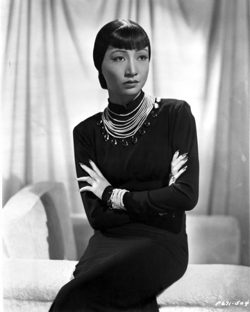 Anna Wong sitting on the Couch, Arms Crossed Photo by  Movie Star News