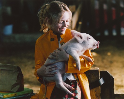 Dakota Fanning with Pig Portrait Photo by  Movie Star News