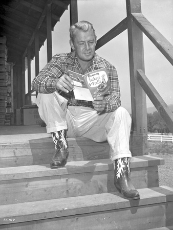 Alan Ladd sitting on the Stairs Reading Close Up Portrait Photo by  Movie Star News
