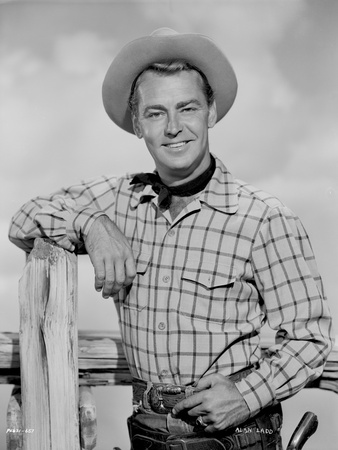 Alan Ladd smiling Near the Fence in Cowboy Outfit Photo by  Movie Star News