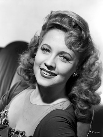 Ann Jeffreys sitting and smiling Photo by  Movie Star News