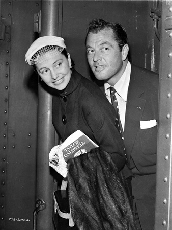 Cyd Charisse smiling and Holding a Book and a Jacket Photo by  Movie Star News