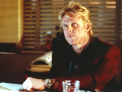 Gary Busey sitting in Red Long Sleeves Portrait Photo by  Movie Star News