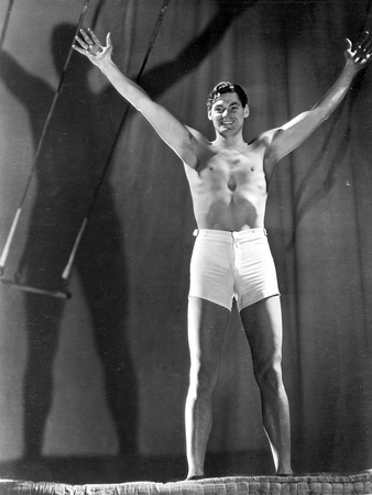 Johnny Weissmuller wearing a White Shorts and Raising His Two Hands Photo by  Movie Star News