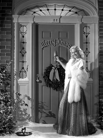 Marilyn Maxwell standing Outside the Door, wearing Black Dress with White Fur Shawl Photo by  Movie Star News