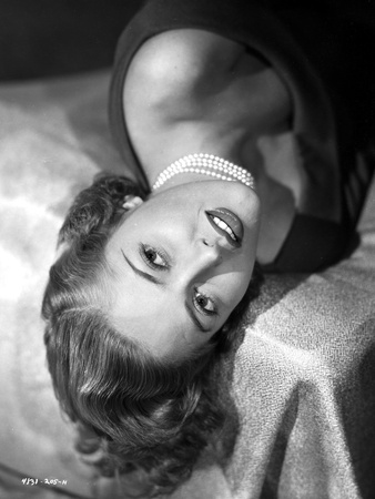 Martha Vickers Lying on Bed wearing Pearl Necklace Photo by  Movie Star News