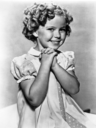 Shirley Temple wearing a Cap-Sleeve House Dress Photo by  Movie Star News