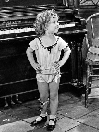 Shirley Temple wearing a Short House Dress Photo by  Movie Star News