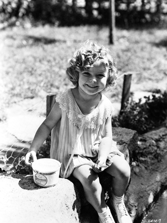 Shirley Temple sitting on the River Bank in aClassic Portrait Photo by  Movie Star News