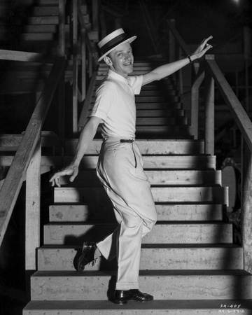 Fred Astaire standing on Dining Table Photo by  Hendrickson