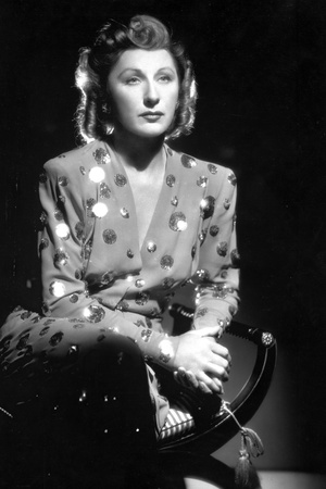 Judith Anderson wearing a Glittering V-Neck Tunic in a Classic Portrait Photo by  Movie Star News