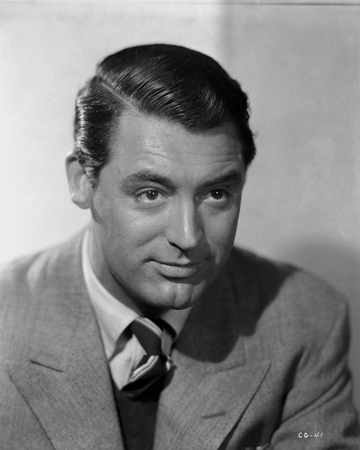 Cary Grant wearing a Gray Suit and Necktie Photo by E Bachrach