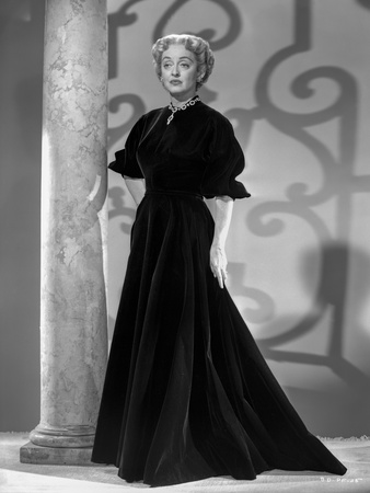 Bette Davis Posed Hands on the Waist in Ruffled Short Sleeve High Neck Black Dress Photo by Gaston Longet