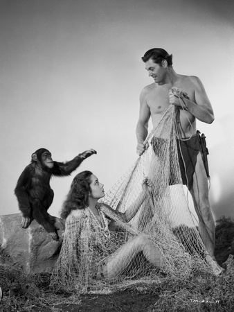 Johnny Weissmuller Releasing a Woman from a Fish Net in a Classic Movie Scene Photo by  Movie Star News