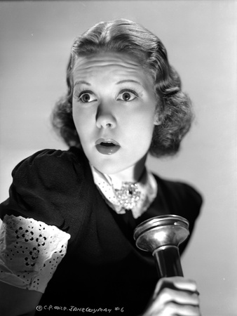 Jane Wyman Portrait in Black Velvet Shirt and Curtain Curl Hair with Hands Holding a Flashlight Photo by  Movie Star News