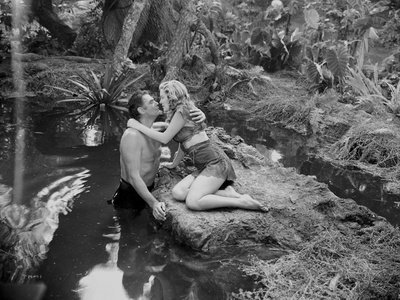 Johnny Weissmuller Kissing with a Woman in the River in a Classic Movie Scene Photo by  Movie Star News