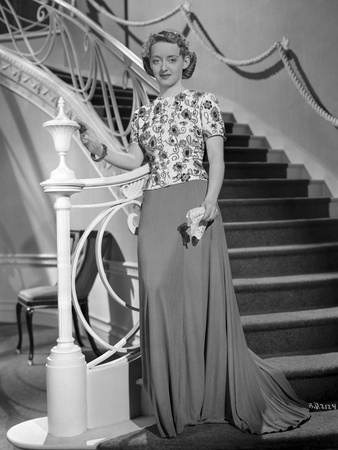 Bette Davis standing Beside on a White Staircase Metal Railin Photo by Scotty Welbourne