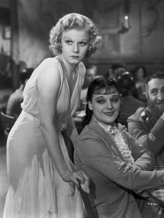 Jean Harlow Scene from a Film standing while Leaning Forward in White Silk Dress Photo by Virgil Apger