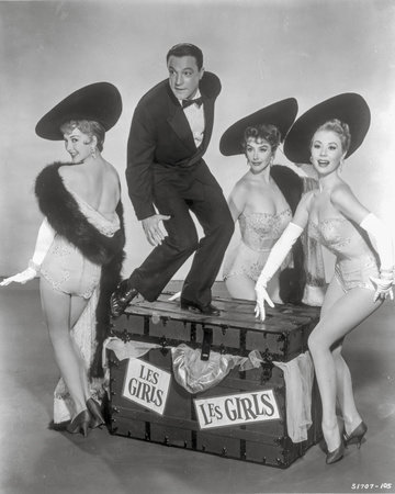 Les Girls Three Woman and a Man Looking Happy in Black and White Photo by  Movie Star News