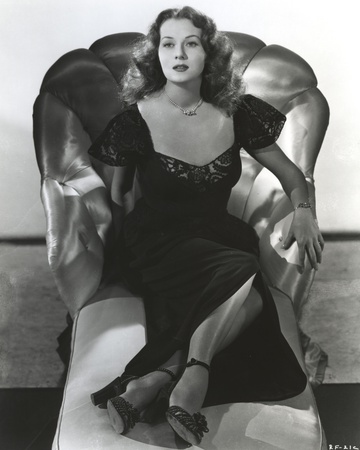 Rhonda Fleming Relaxing on a Couch wearing a Black Gown Photo by  Movie Star News