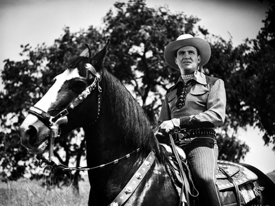 Gene Autry Riding a Horse with Trees on Background Photo by  Movie Star News