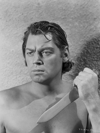 Johnny Weissmuller Holding Knife in Black and White Photo by  Movie Star News