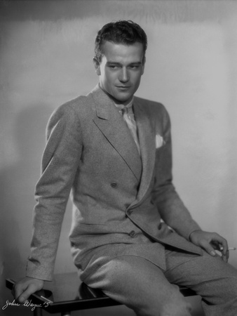 John Wayne wearing a Grey Suit and a Pants Photo by  Fraker