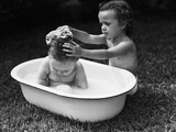 Baby Siblings Taking a Bath Photographic Print by Bettmann 